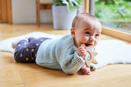 Baby with hedgehog shaped wooden grasping and teether toy | Conscious Craft