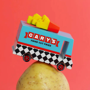 Candylab wooden toy French Fry van placed on top of a potato with red background | Conscious Craft
