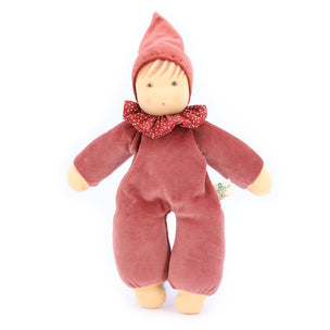 Stuffed toy resembling a gnome in a red outfit with a white background