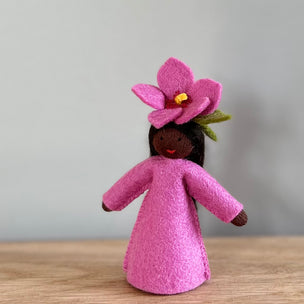 A Pink Felt Hibiscus decorative Flower Fairy with dark skin tone | © Conscious Craft