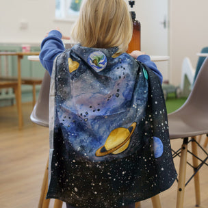 Child wearing a Giant Solar System Wondercloth by Wonderie | Conscious Craft
