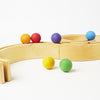 Grimm's marble run, natural 12 piece tunnel, 6 rainbow balls | Image © Conscious Craft