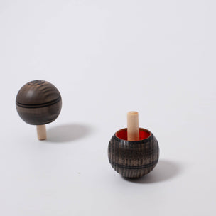 Turn over Spinning Top in grey with red or green | © Conscious Craft