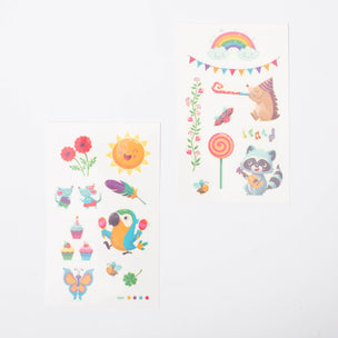 Namaki's Rainbow tattoos butterfly, sun, rainbow and parrot with maracas