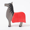 Wooden toy horse with red blanket | © Conscious Craft