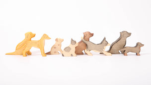 a range of 8 wooden toy dogs from Eric & Albert, including 3 labradors, a lurcher, jack russel, french bulldog, collie and a dachshund | © Conscious Craft