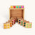 Set of wooden blocks with colored dots on a white background