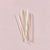 White candles on a pink background