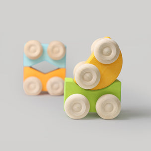 Colorful wooden toy cars with wheels on a gray background