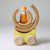 Grimm's Wooden toy car with a small figure and circular elements on a light gray background
