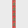 Decorative ribbon with Christmas tree pattern on a red background