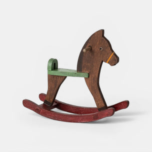 Wooden rocking horse on a white background