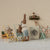 Maileg Miniature scene with toy figures in a laundry room setting.