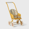 Maileg Yellow toy stroller with floral seat on a white background