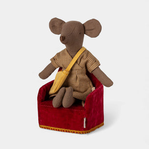 Stuffed Maileg mouse toy in a red chair on a white background