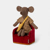Stuffed Maileg mouse toy in a red chair on a white background