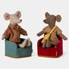 Two Maileg oy mice sitting on chairs with a plain background