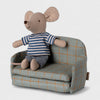 Maileg Stuffed mouse toy in a striped shirt sitting on a small sofa with a checkered pattern.