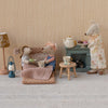 Maileg Miniature scene with toy mice in a living room setting, including a sofa, lamp, and small table.