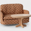 Maileg Polka dot sofa with a wooden table on a white background