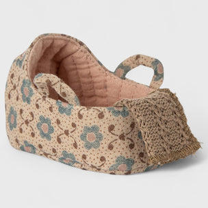 Maileg Textured fabric carry cot with floral pattern on a light gray background