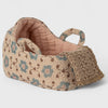 Maileg Textured fabric carry cot with floral pattern on a light gray background