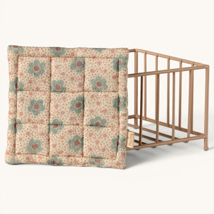 Maileg Floral-patterned cushion next to a baby crib on a white background