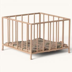 Maileg Beige crib with floral mattress on a white background