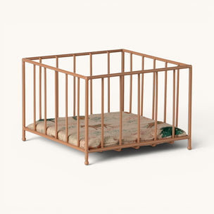 Metallic pink maileg [playpen crib with a mattress on a white background