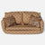 A vintage-style upholstered loveseat Maileg Mice sofa in a warm tan and brown floral pattern, featuring two matching floral throw pillows, photographed against a plain light gray background.