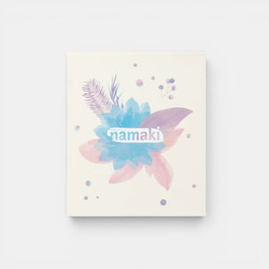 Notebook with floral design and 'namaki' branding on a light background