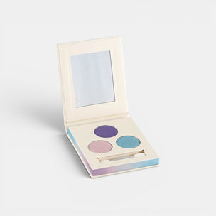 Makeup palette with three colors and a mirror on a white background