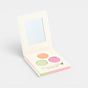 Makeup compact with colorful shades on a light gray background