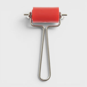 Red roller with a metal handle on a white background
