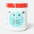 A white plastic tub of Rico Kids Klebebaste Glue Paste with a bright red lid and a light blue smiley face label, shown on a clean white background.