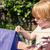 Child playing with a kite in a garden