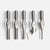 Five metallic carving or sculpting tools arranged upright on a light gray background, with engraved numbers 1 through 5 visible on the handles.