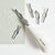 White carving tool with interchangeable heads on a white background