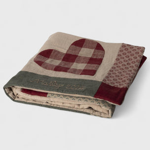 Maileg Folded quilt with a heart design on a light gray background