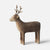 A minimalist wooden Maileg deer figurine with antlers, shown in profile against a clean white background.
