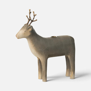A sculptural Maileg deer-shaped candle holder with a matte beige finish and a small brass candle holder slot on its back, shown against a light gray background.