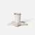 An off-white Maileg candle holder with a ribbed cylindrical cup and a star-shaped base, accented with a metallic gold rim, set against a plain light gray background.