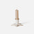 A single lit cream-colored candle in a white Maileg star-shaped holder with subtle gold-toned detailing, set against a clean white background.