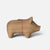 A small Maileg wooden pig-shaped candle holder with a red and white striped rope tied around its neck and a brass candle holder on its back, set against a light gray background.