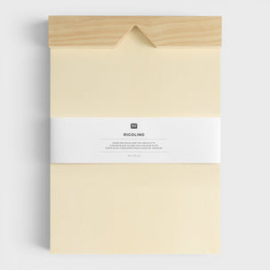 Packaged product with a beige cover and white label on a light gray background