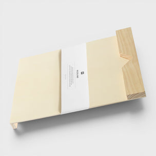 Wooden block with a paper label on a white background