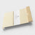 Wooden block with a paper label on a white background