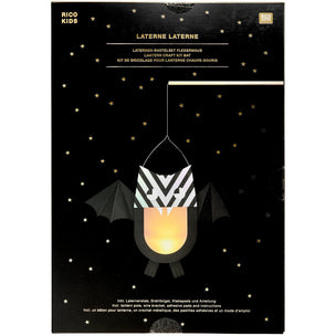 Rico Kids Laterne Laterne bat lantern craft kit in its original black packaging, featuring a bat lantern illustration with a black and white chevron pattern and a glowing yellow-orange light inside, set against a starry night sky background.