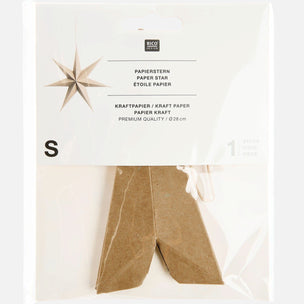 A packaged paper star decoration in a clear plastic bag with a white header card. The star is made of brown kraft paper and is labeled with the brand RICO DESIGN and size S.