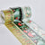 Three rolls of decorative washi tape with festive woodland and winter illustrations, including carrots, mushrooms, stars, and snowflakes, displayed on a light gray background.